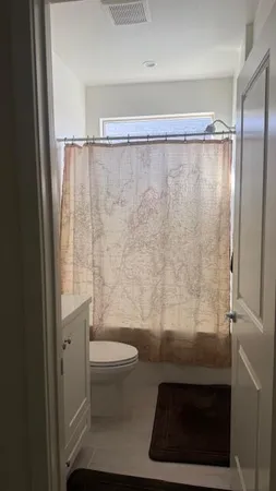 a bedroom with a bed and dresser