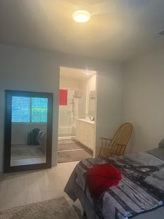 a view of a porch with furniture and a potted plant