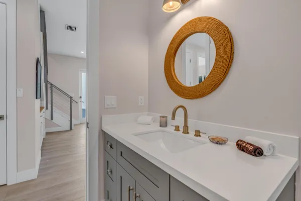 a bedroom with two beds and a painting on the wall