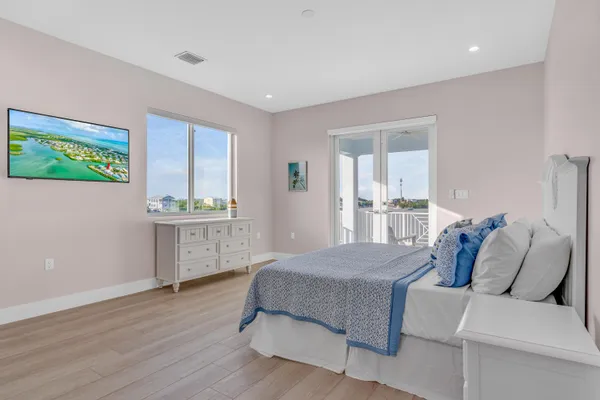 a bedroom with a bed and a dresser