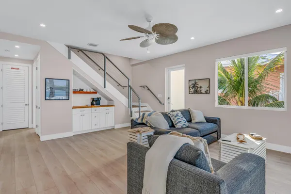 a bedroom with furniture and a flat screen tv