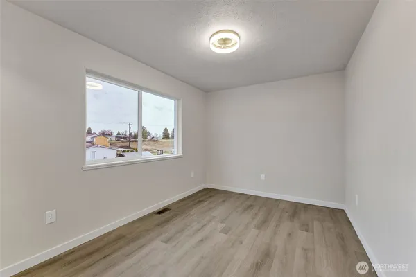 a view of a livingroom with wooden floor