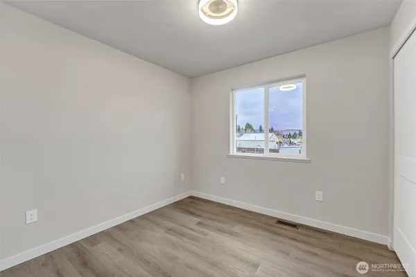 a view of kitchen with wooden floor