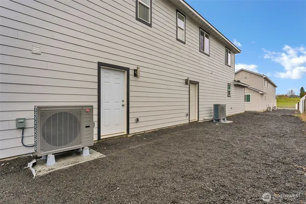 a view of a house with a yard and garage