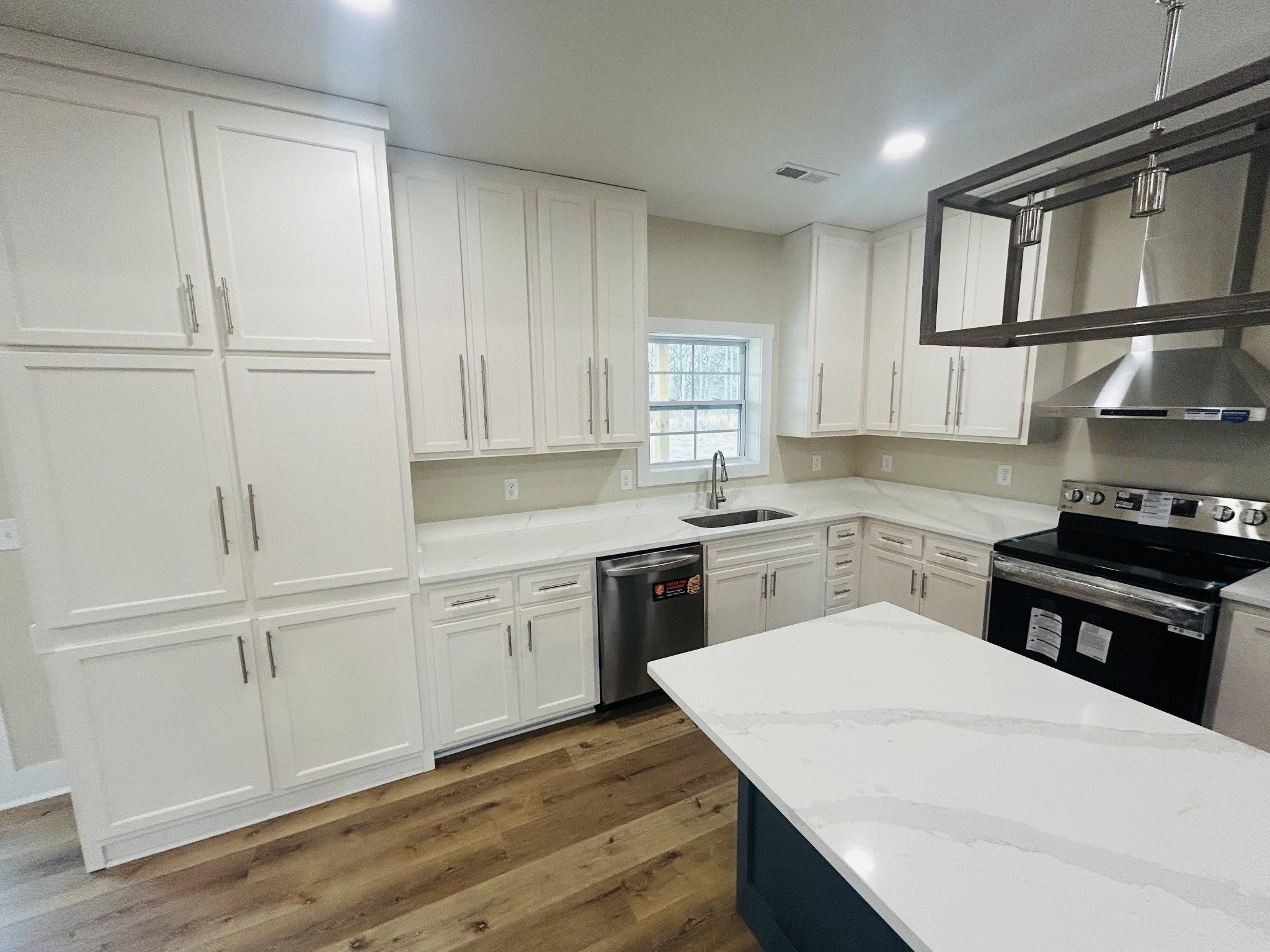 50 Aedc Lakeview Road Estill Springs, TN 37330 - Photo 12 of 25 a kitchen with white cabinets and white appliances