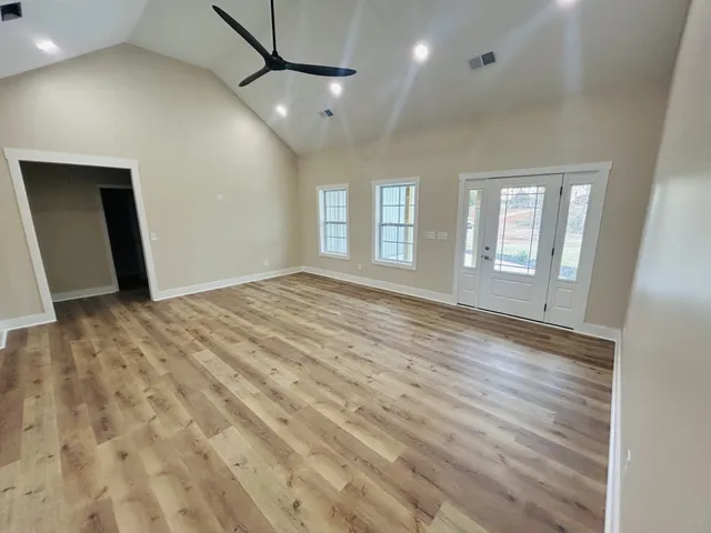 a bathroom with a double vanity sink toilet and a mirror