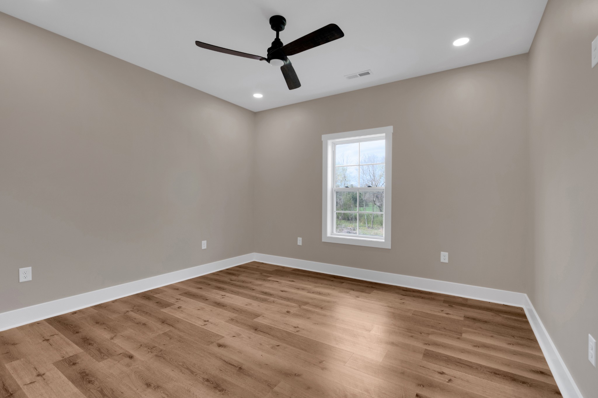 50 Aedc Lakeview Road Estill Springs, TN 37330 - Photo 15 of 22 an empty room with wooden floor and windows