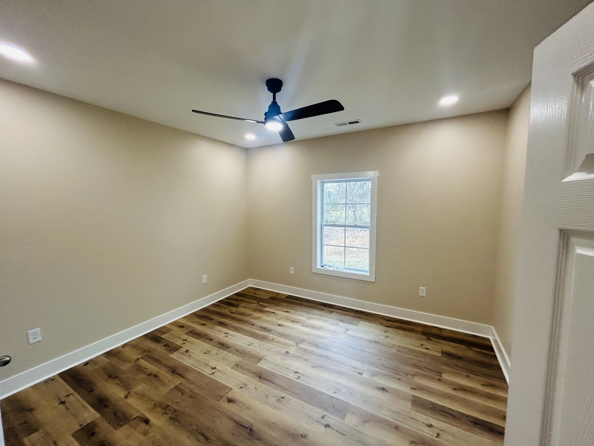 50 Aedc Lakeview Road Estill Springs, TN 37330 - Photo 19 of 25 wooden floor in an empty room with a window