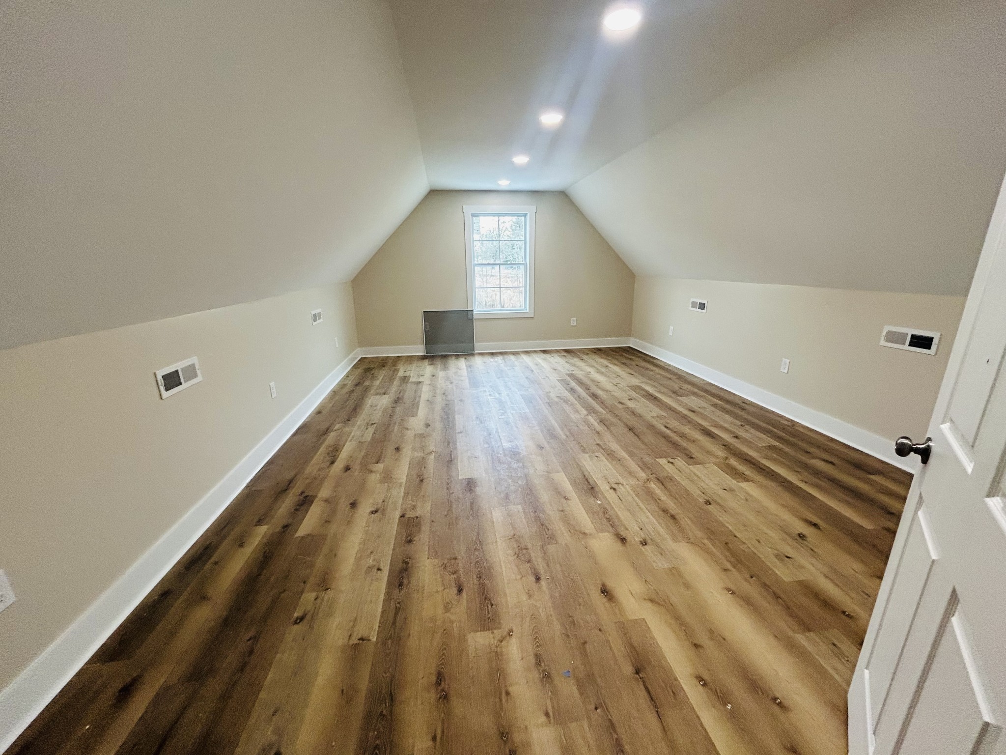 50 Aedc Lakeview Road Estill Springs, TN 37330 - Photo 23 of 25 wooden floor in an empty room with a window
