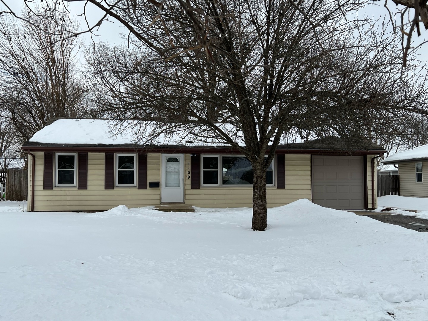 1109 Westminster Road Joliet, IL 60435 - Photo 1 of 20 a house with trees in front of it