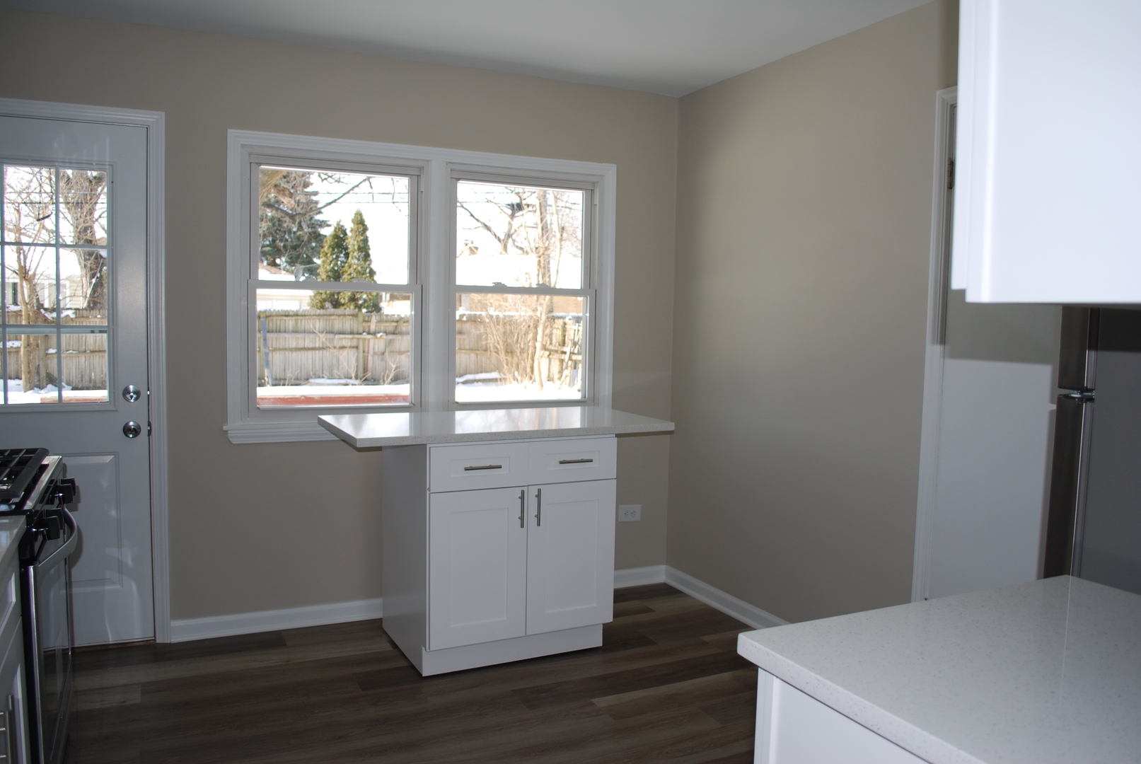 1109 Westminster Road Joliet, IL 60435 - Photo 6 of 20 a room with a window and wooden floor