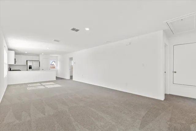 a kitchen with stainless steel appliances a refrigerator stove microwave and sink