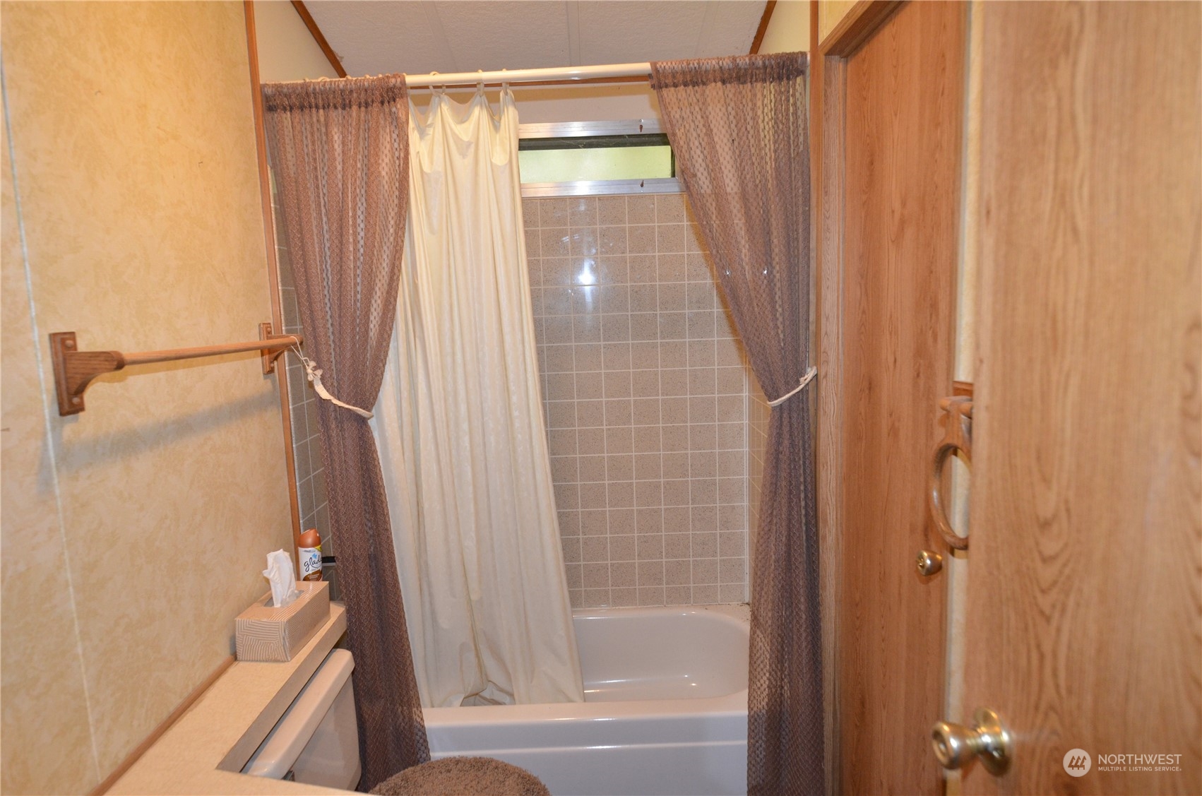 12712 Northeast 199th Street Bothell, WA 98011 - Photo 13 of 21 a bathroom with a shower and a tub