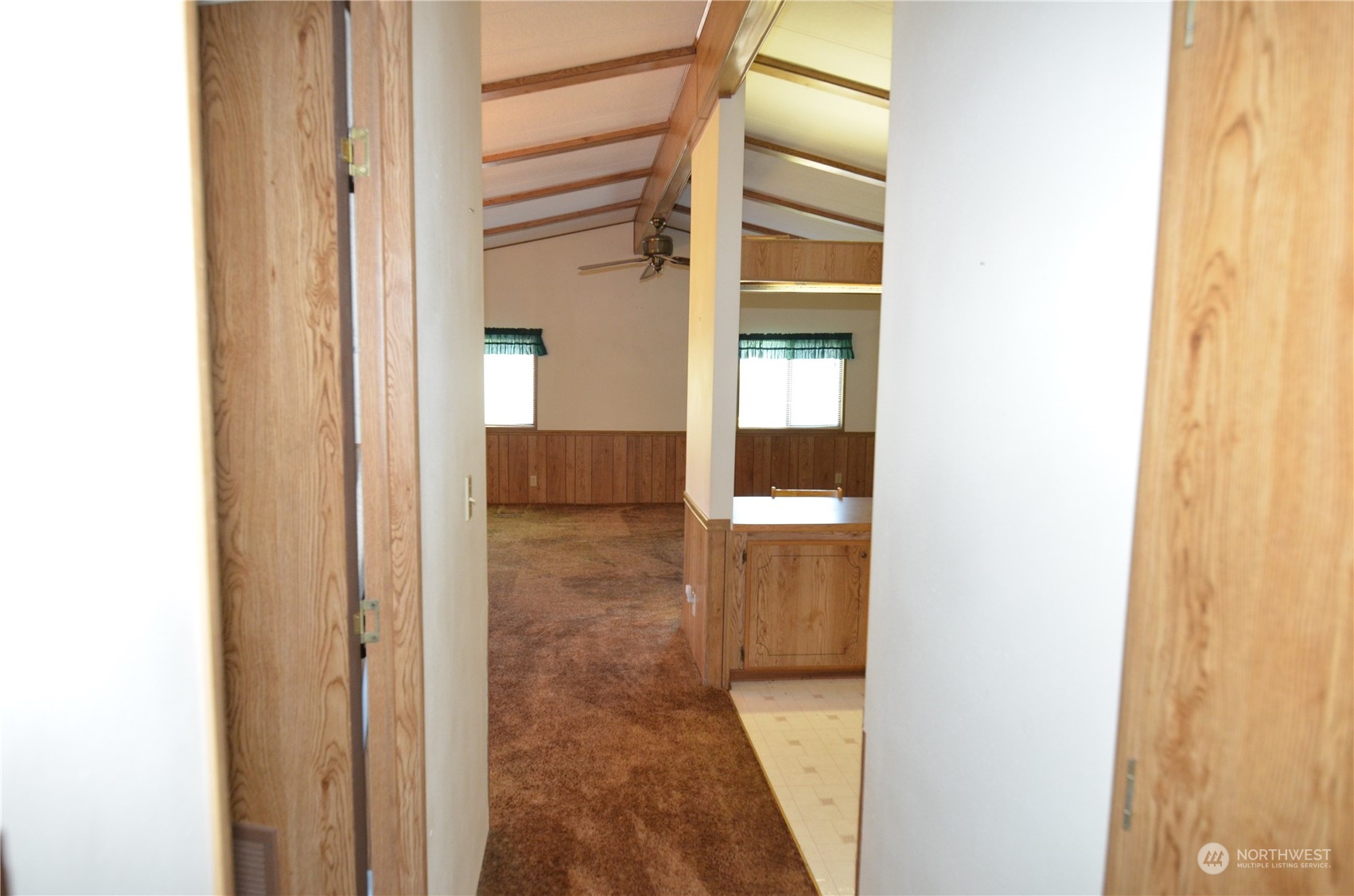 12712 Northeast 199th Street Bothell, WA 98011 - Photo 14 of 21 a view of a hallway with wooden floor