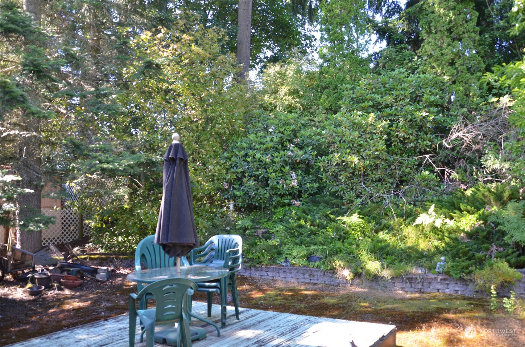 12712 Northeast 199th Street Bothell, WA 98011 - Photo 15 of 21 a view of a outdoor space with a table and chairs