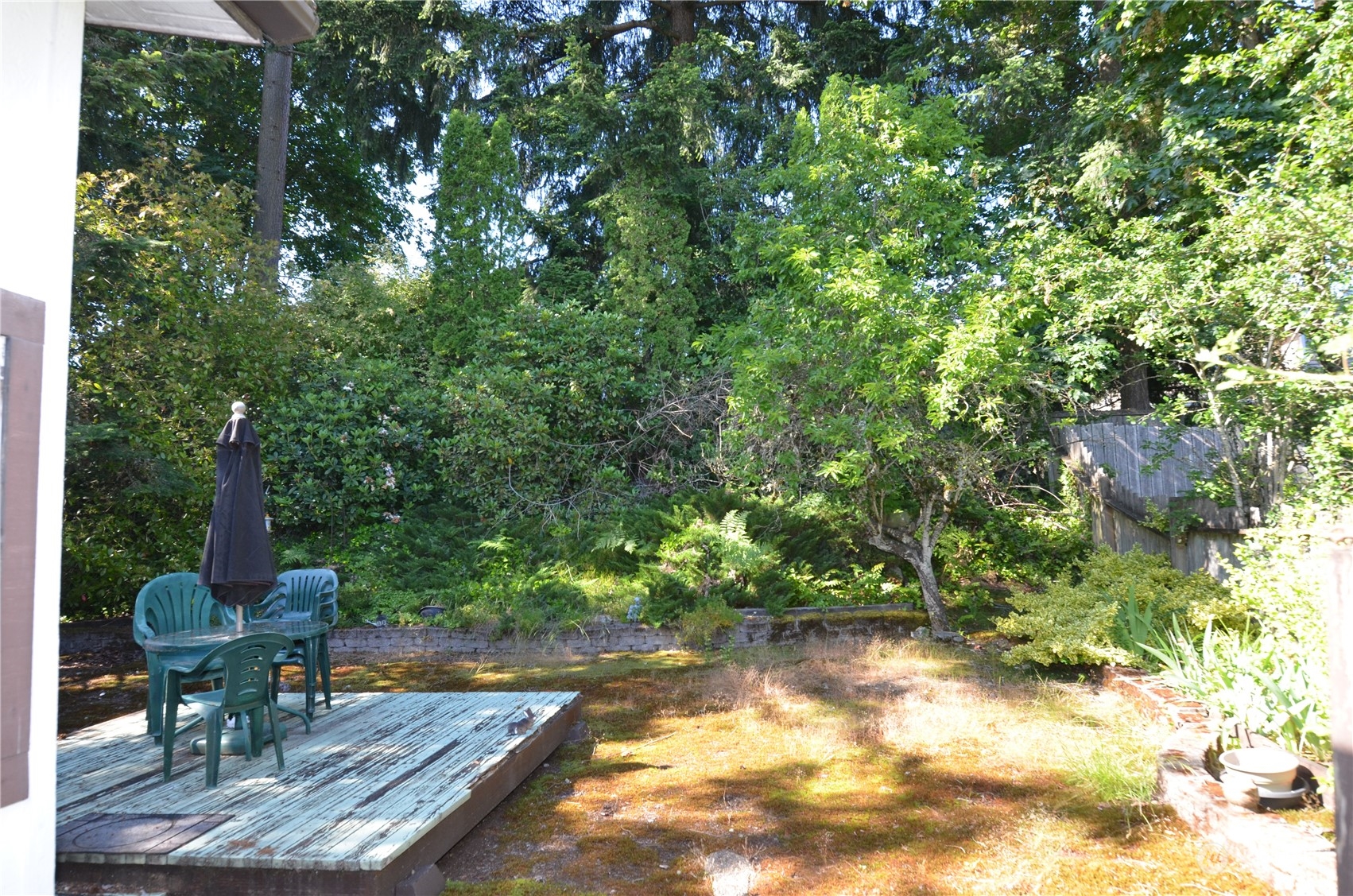 12712 Northeast 199th Street Bothell, WA 98011 - Photo 17 of 21 a view of a backyard with sitting area