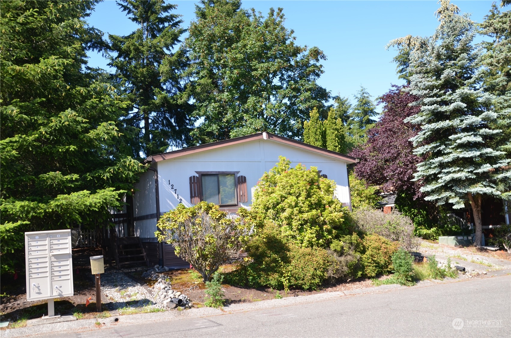 12712 Northeast 199th Street Bothell, WA 98011 - Photo 18 of 21 a front view of a house with a yard