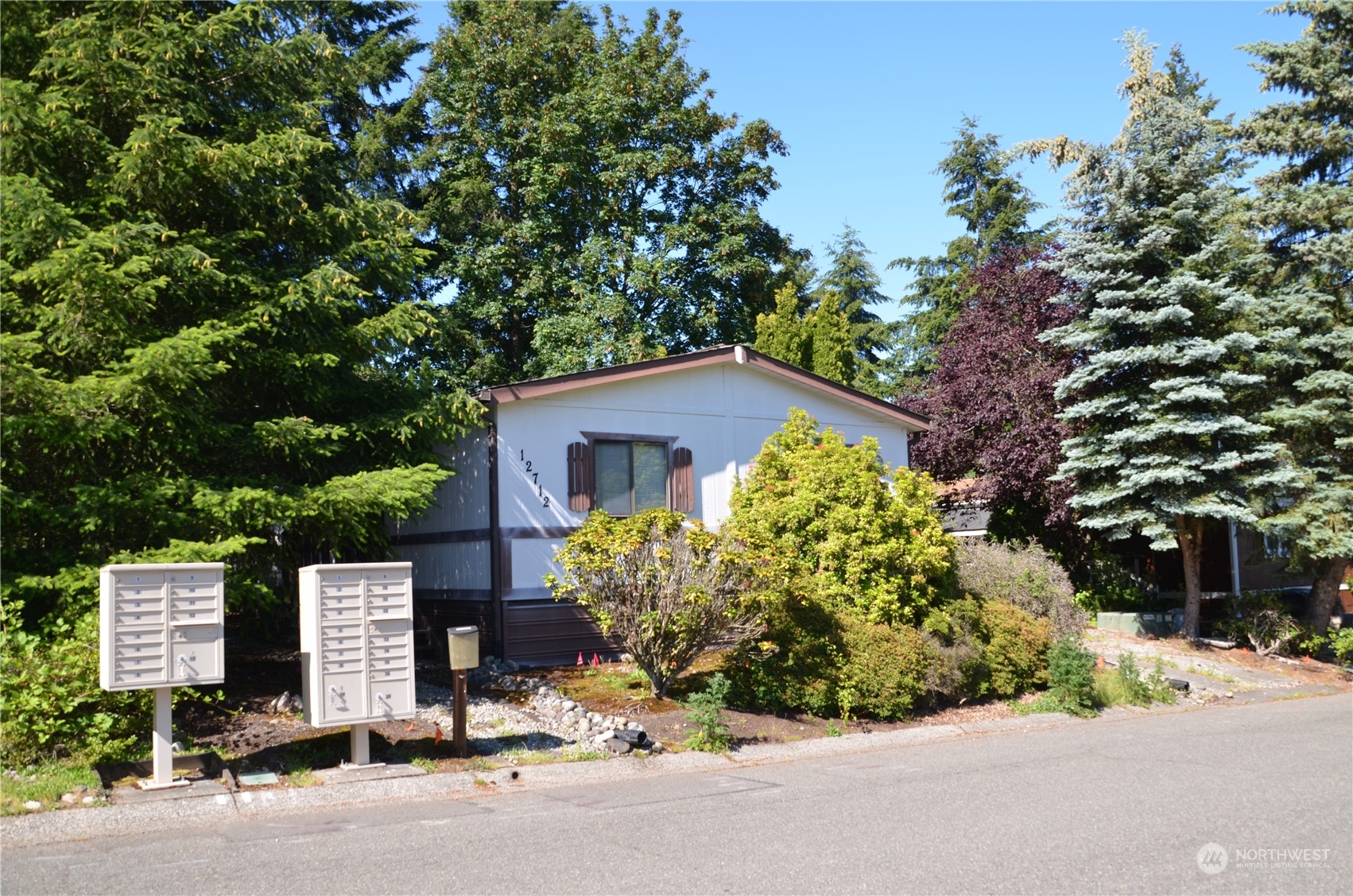 12712 Northeast 199th Street Bothell, WA 98011 - Photo 20 of 21 a front view of a house with a yard