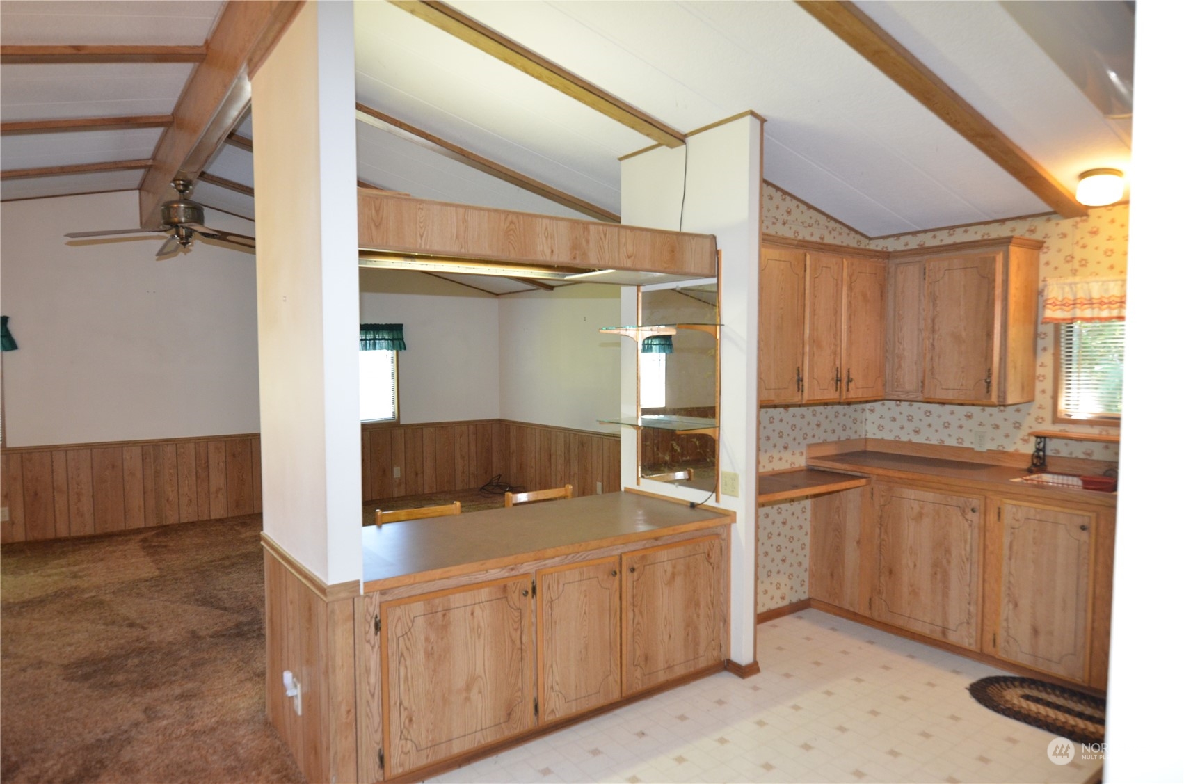 12712 Northeast 199th Street Bothell, WA 98011 - Photo 3 of 21 a kitchen with stainless steel appliances granite countertop a refrigerator a sink and white cabinets
