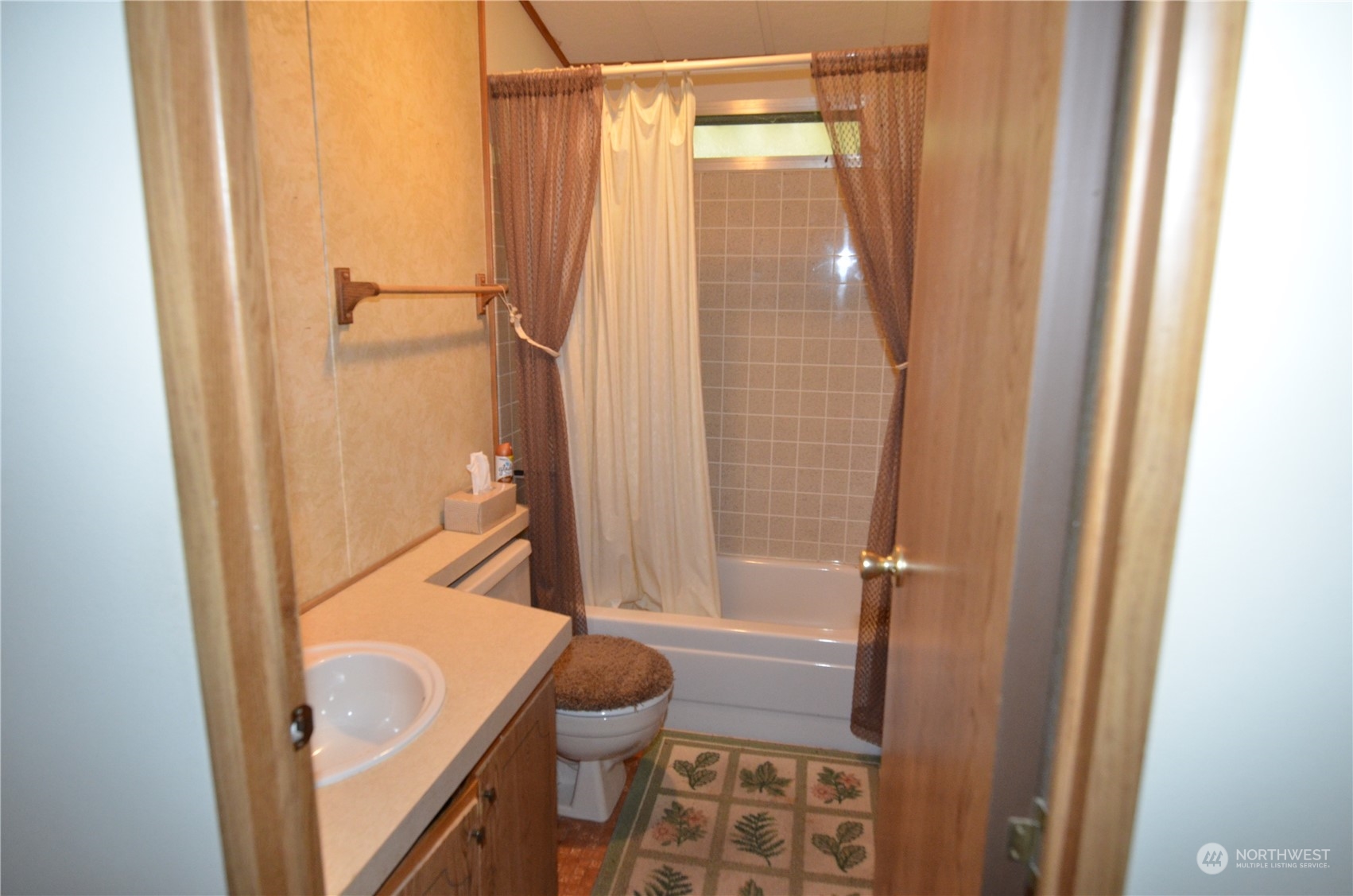 12712 Northeast 199th Street Bothell, WA 98011 - Photo 7 of 21 a bathroom with a shower a toilet and a sink
