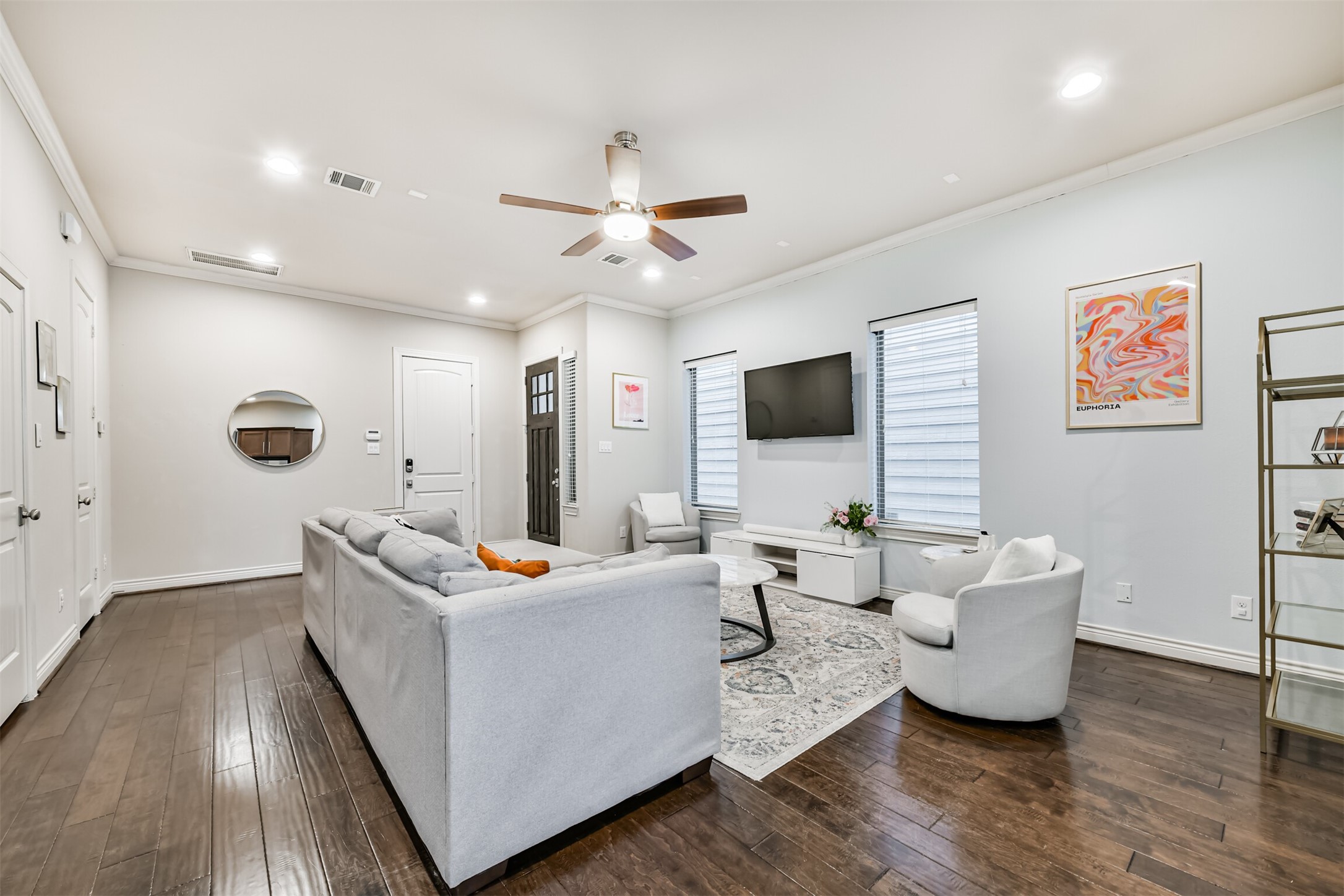 1321 Laird Street Houston, TX 77008 - Photo 5 of 25 Detailed view of the living area, clearly showcasing the spacious dimensions of the room and the attractive, well-maintained wood flooring throughout.