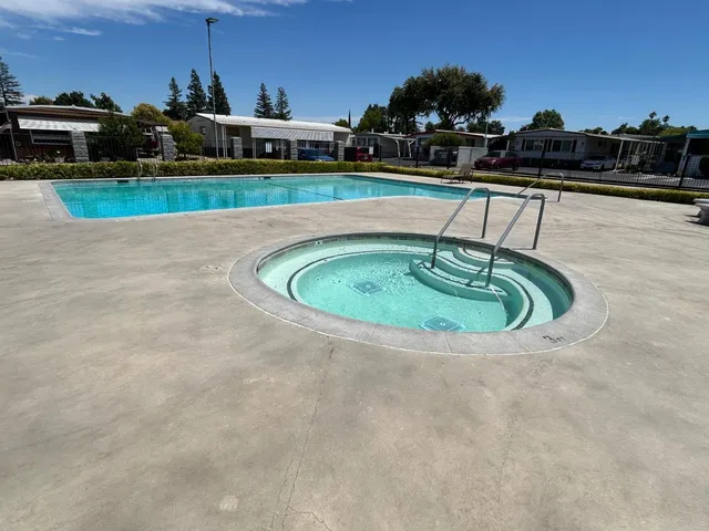 a view of swimming pool from a balcony