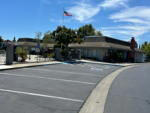 a view of a water fountain in front of a house