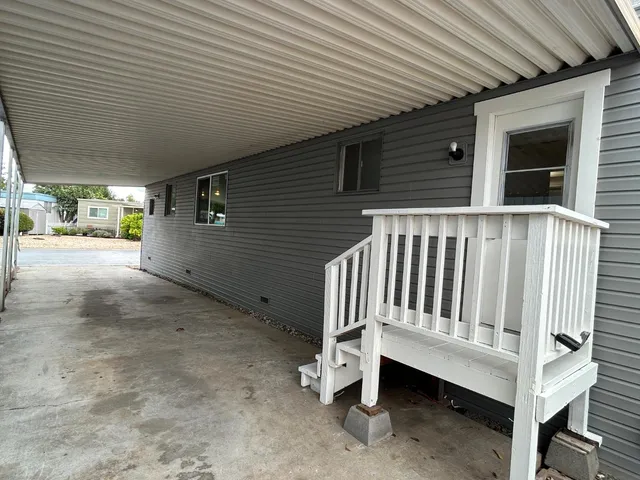 a view of outdoor space with deck and white umbrellas