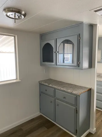 a view of cabinets and wooden floor