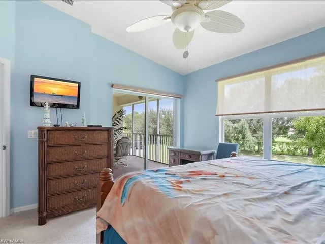 a bedroom with a bed and a tv