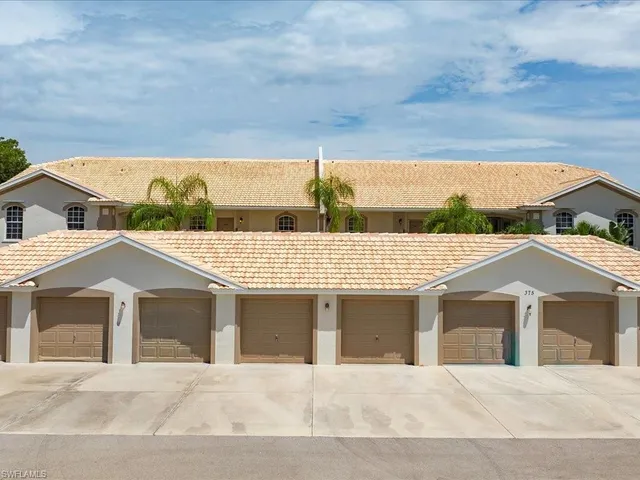 a view of a brick house with a yard
