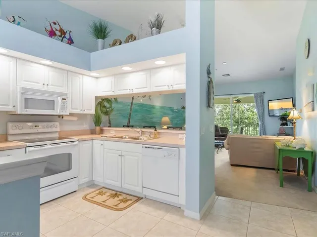 a kitchen with furniture and window