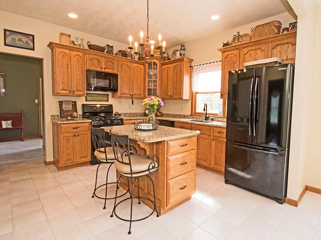 1460 Cavitt Road Monroeville, PA 15146 - Photo 8 of 25 KITCHEN WITH ENTRANCE TO THE HOME OFFICE/ MUDROOM IN BACKGROUND