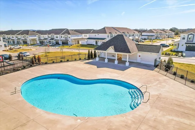 a view of a swimming pool with a lounge chairs