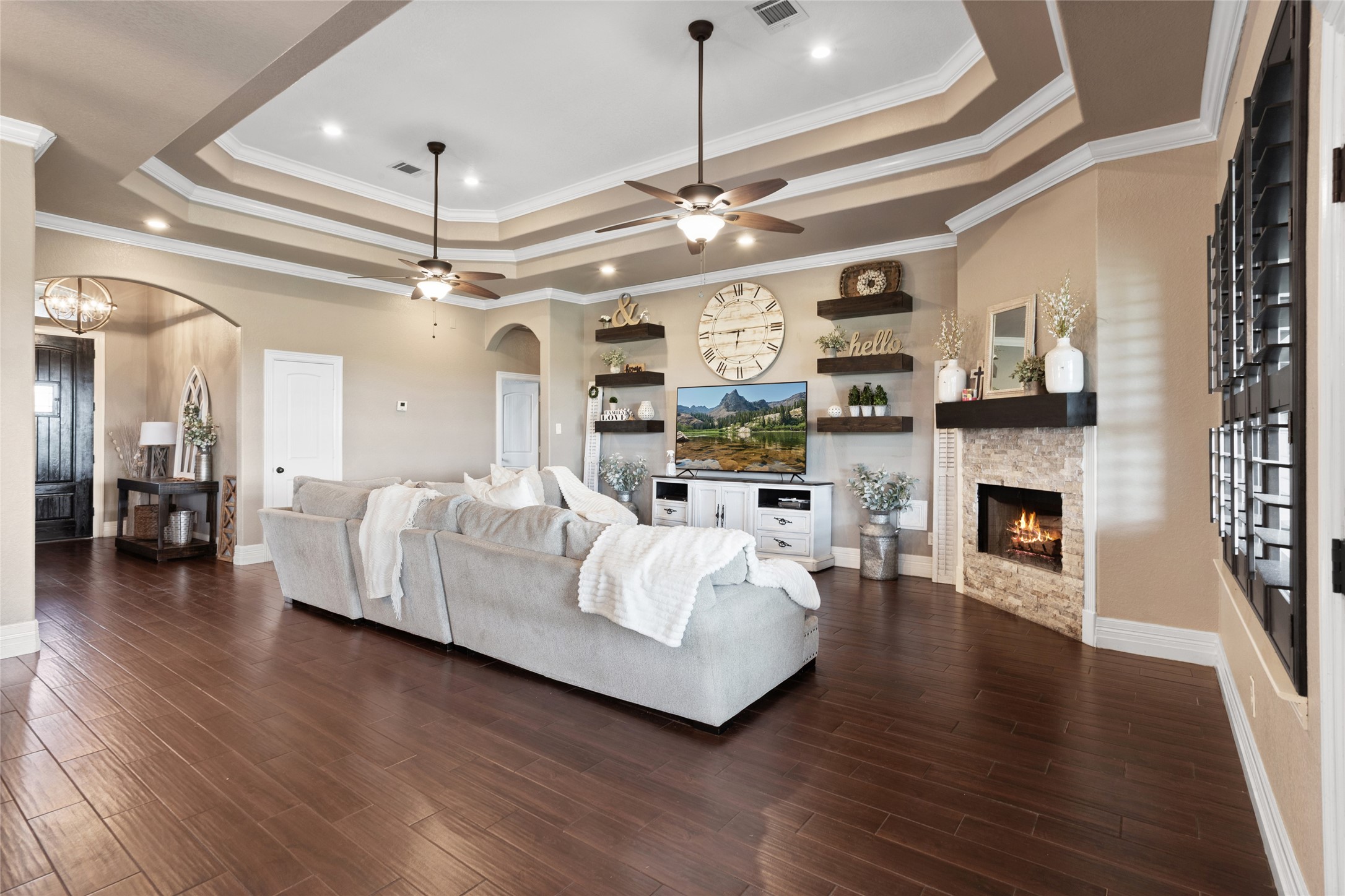 7842 Pebble Hill Lane Rosharon, TX 77583 - Photo 10 of 33 a living room with furniture and a fireplace with wooden floor