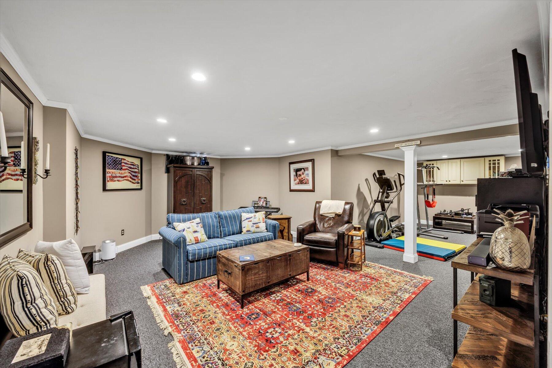 1 Ravens Nest Road Sandwich, MA 02563 - Photo 30 of 46 a living room with furniture and a flat screen tv