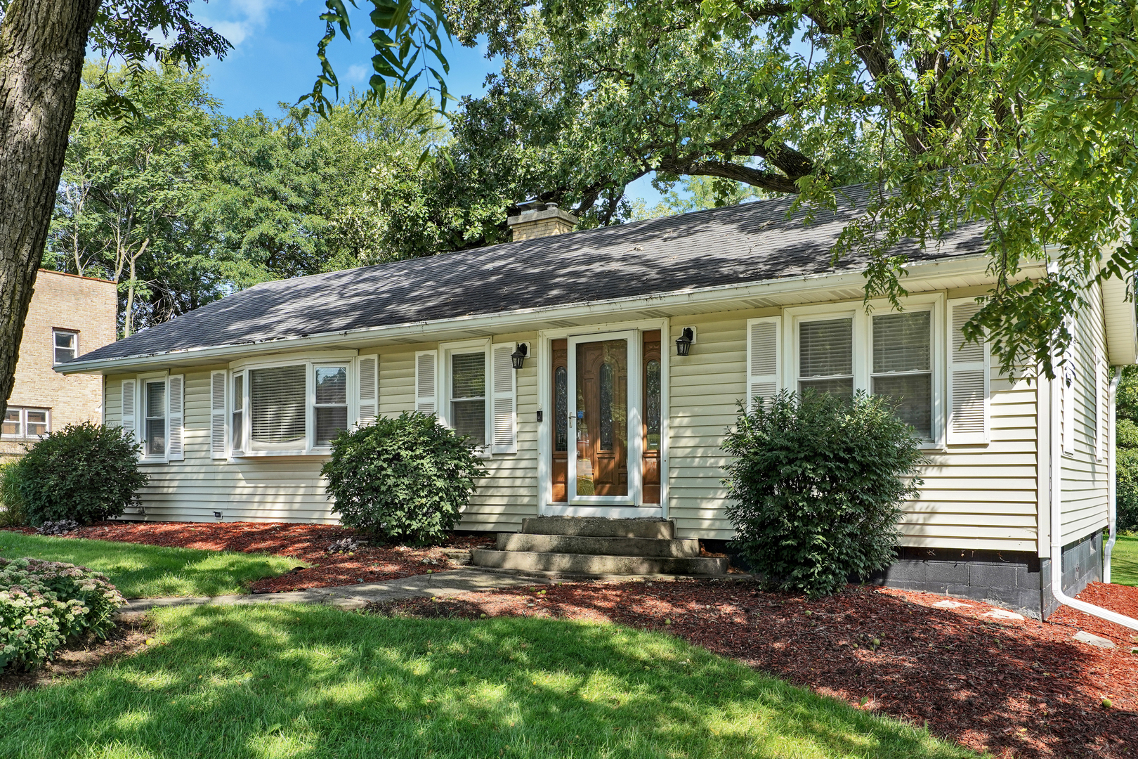 606 St Charles Road Glen Ellyn, IL 60137 - Photo 1 of 28 a front view of a house with garden
