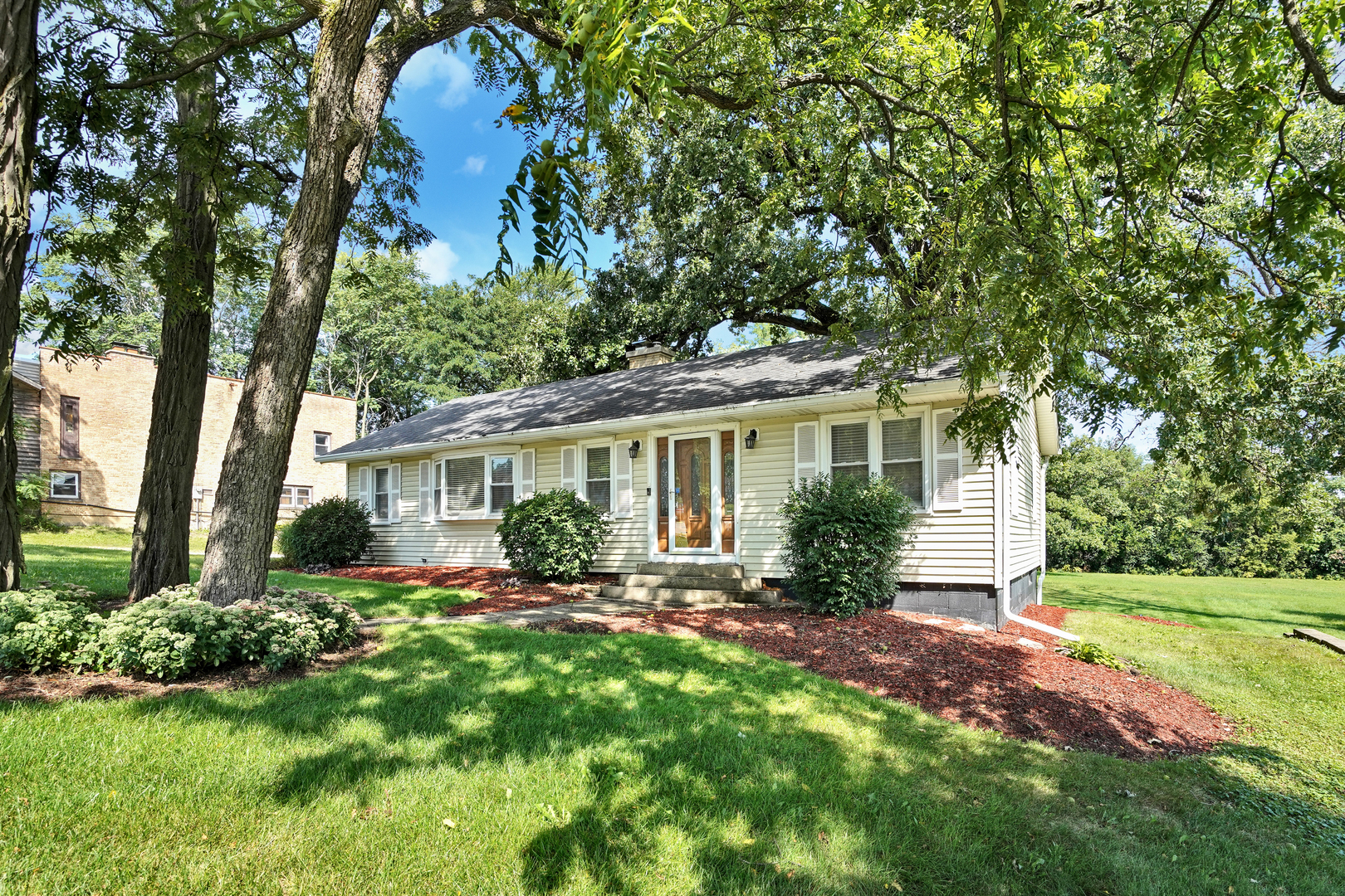 606 St Charles Road Glen Ellyn, IL 60137 - Photo 5 of 28 a front view of a house with a yard