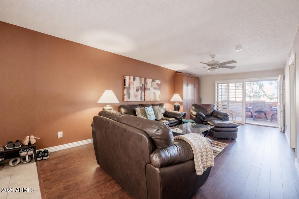4303 East Cactus Road, Unit 403 Phoenix, AZ 85032 - Photo 1 of 37 a living room with furniture window and wooden floor