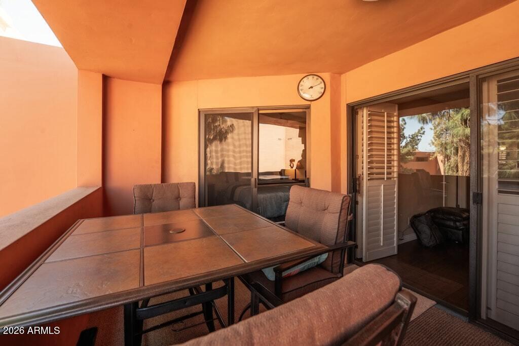 4303 East Cactus Road, Unit 403 Phoenix, AZ 85032 - Photo 24 of 37 a view of a dining room with furniture window and outside view