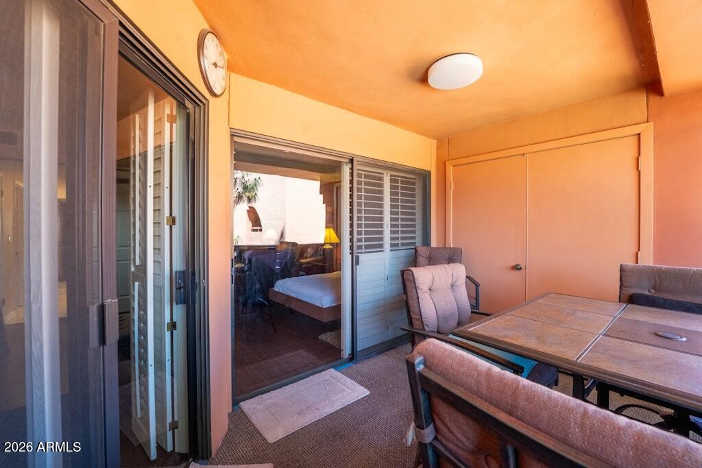 4303 East Cactus Road, Unit 403 Phoenix, AZ 85032 - Photo 25 of 37 a bedroom with furniture and a window