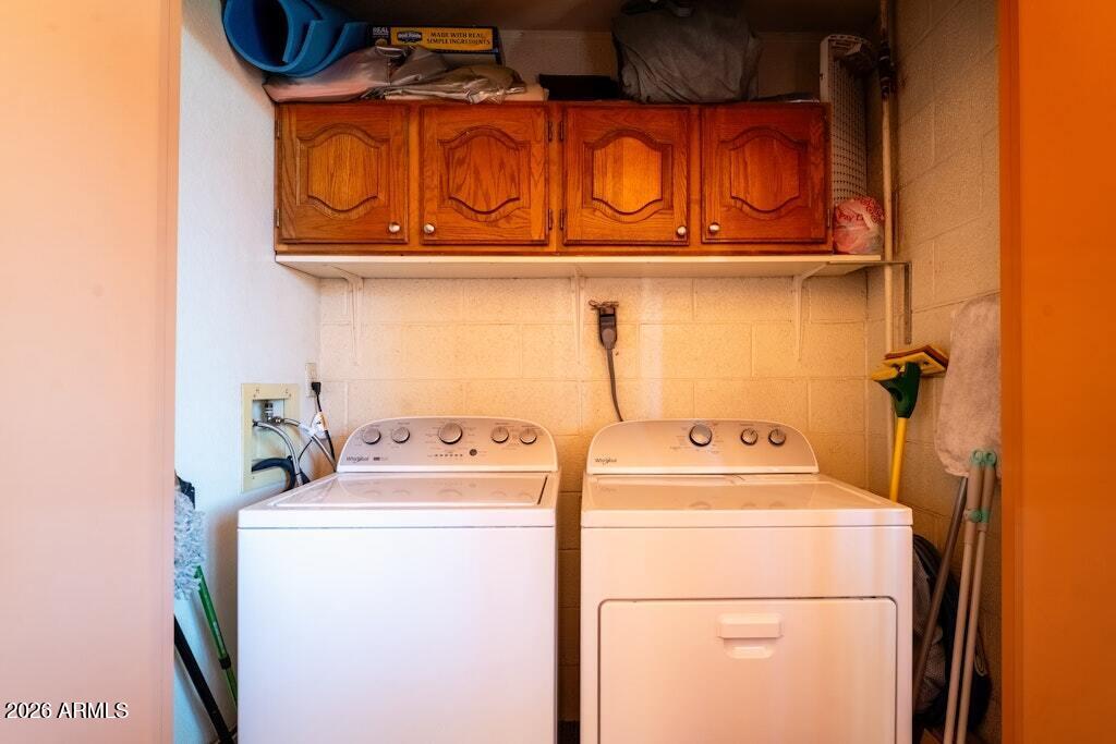 4303 East Cactus Road, Unit 403 Phoenix, AZ 85032 - Photo 27 of 37 a utility room with dryer and washer