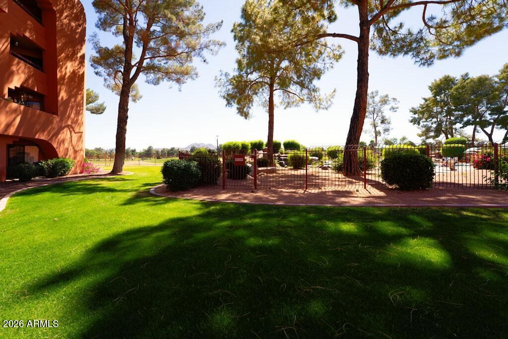 4303 East Cactus Road, Unit 403 Phoenix, AZ 85032 - Photo 32 of 37 a view of a garden with an outdoor space