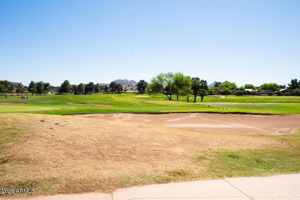 4303 East Cactus Road, Unit 403 Phoenix, AZ 85032 - Photo 33 of 37 a view of a green field with clear sky