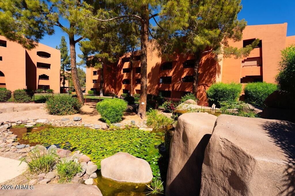4303 East Cactus Road, Unit 403 Phoenix, AZ 85032 - Photo 34 of 37 a view of yard with outdoor seating