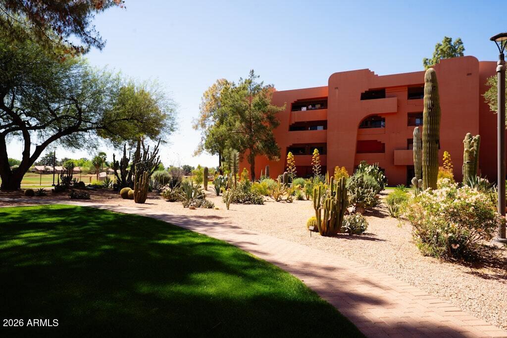 4303 East Cactus Road, Unit 403 Phoenix, AZ 85032 - Photo 37 of 37 a view of a building with a yard
