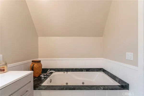a bathroom with a bath tub