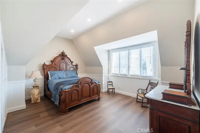 a bedroom with a bed and a desk