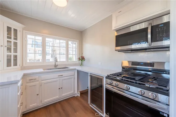 a kitchen with a stove and a microwave