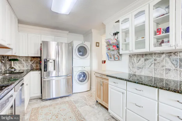 a kitchen with a refrigerator and a stove